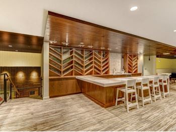 Clubroom with built-in bar and wine storage